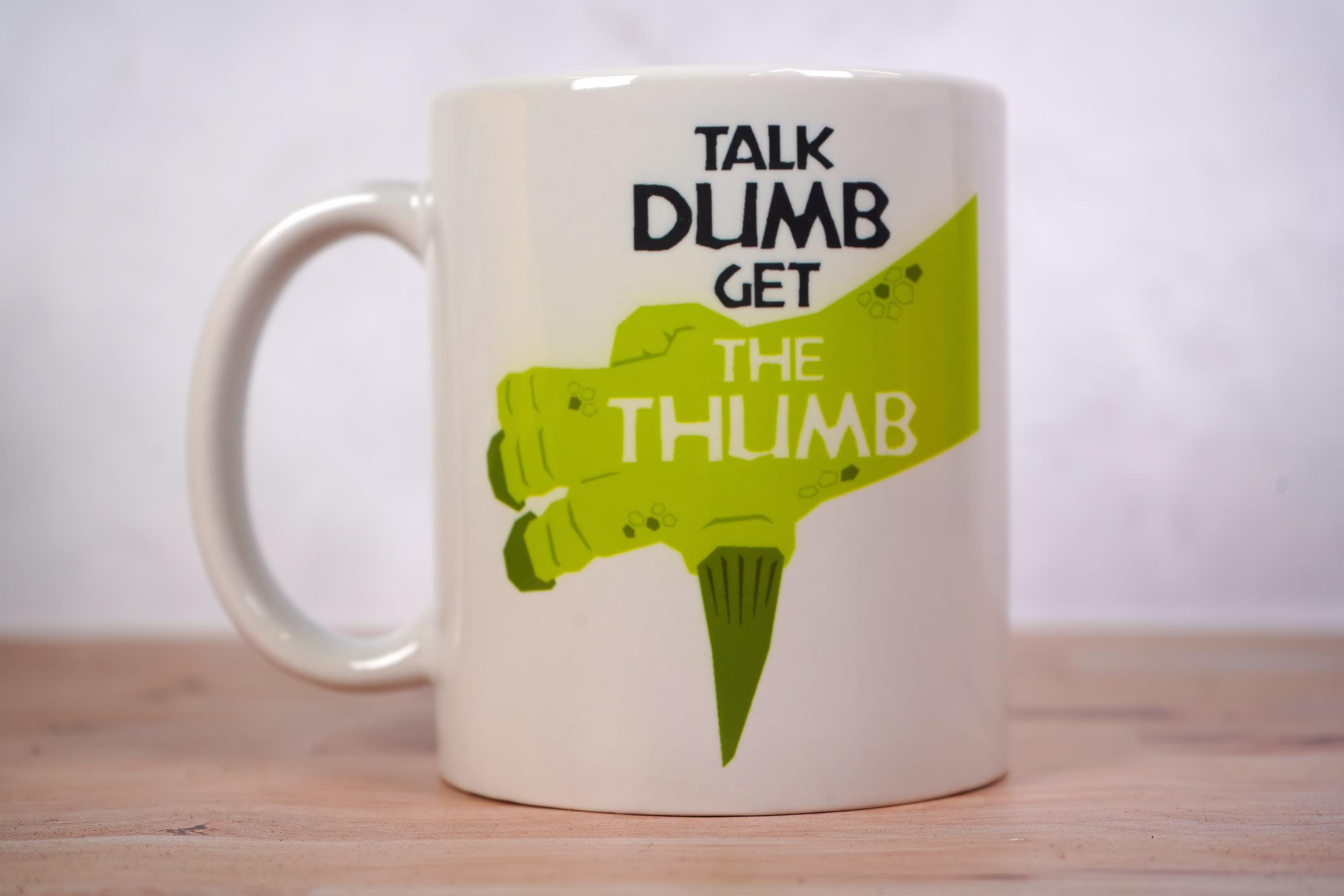 Talk Dumb Get The Thumb Iguanodon Coffee Mug