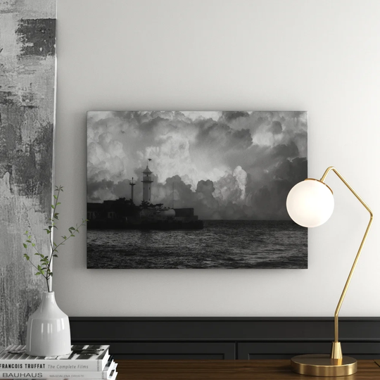 Sailing Boat Next to Lighthouse Graphic Art Print on Canvas